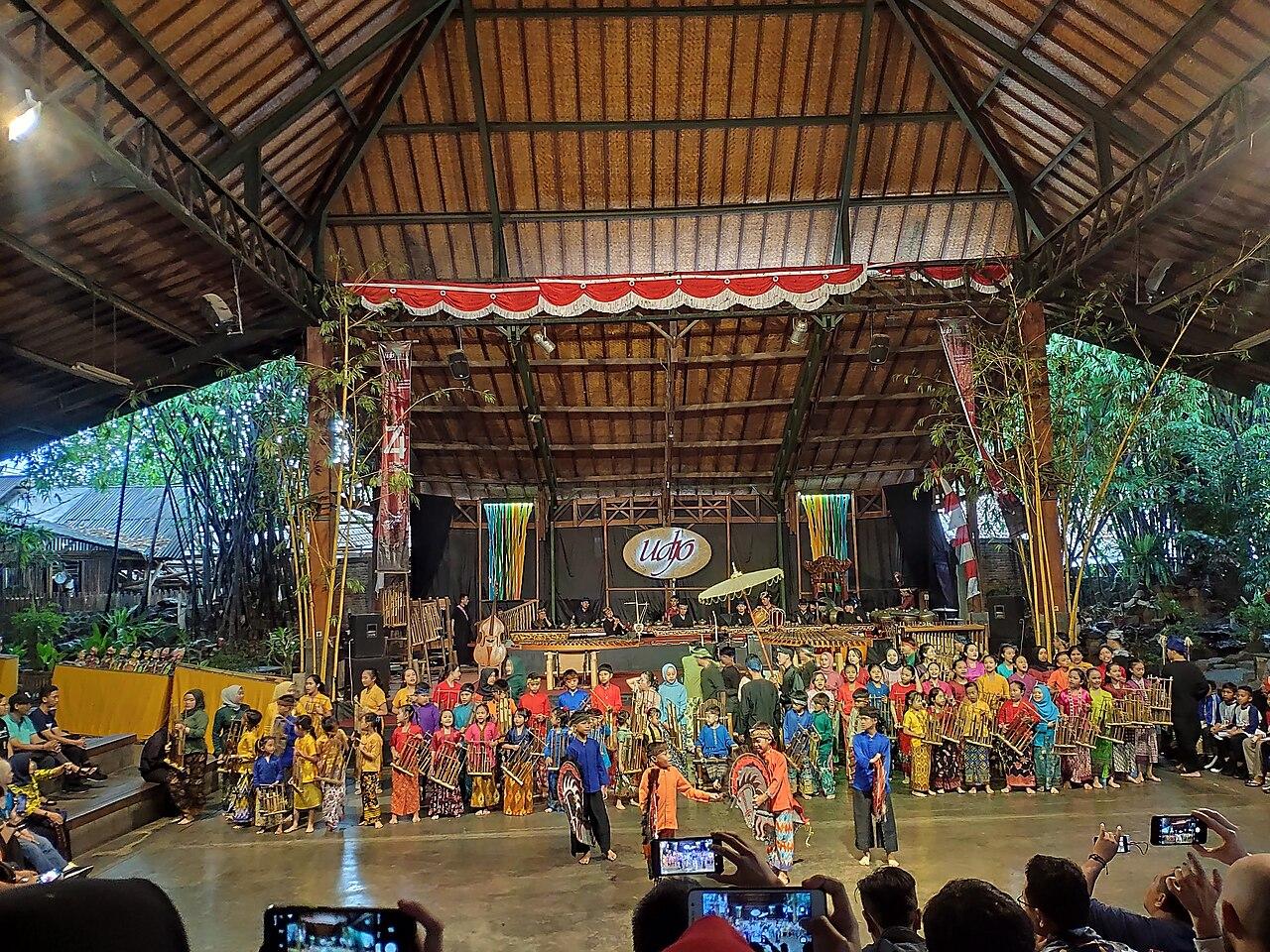 Play Angklung at Saung Angklung Udjo, Bandung, West Java